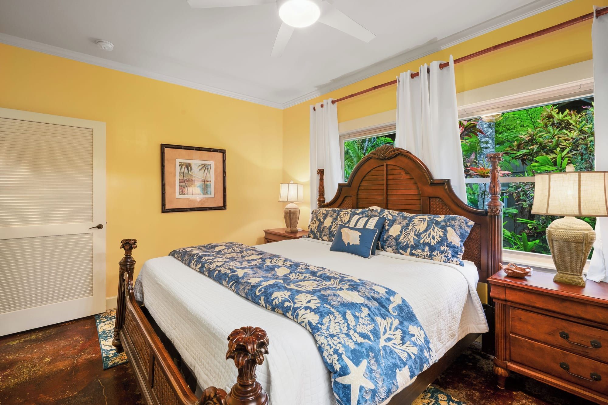 King bed with blue floral bedding
