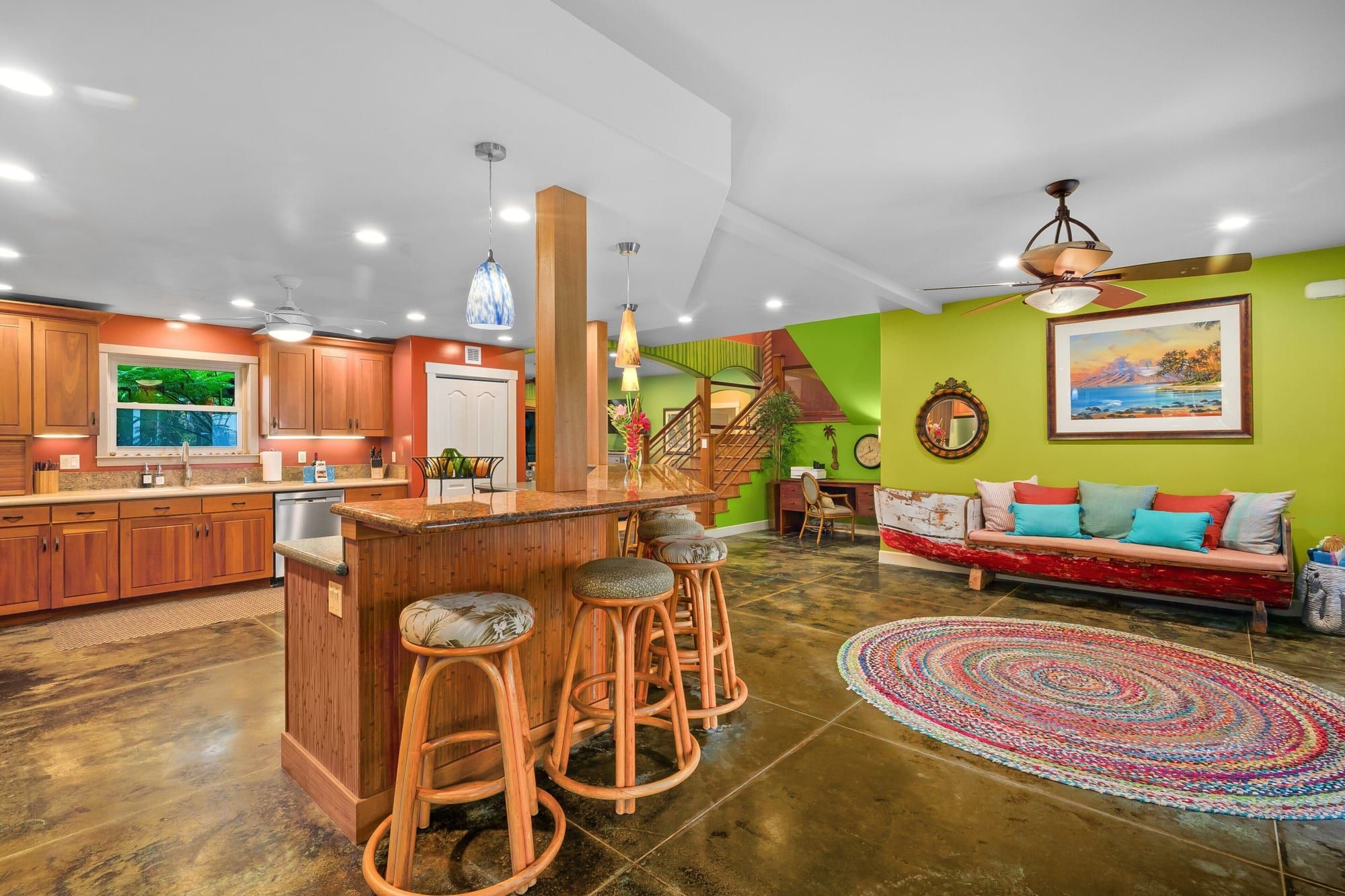 The open kitchen bar and living area with bright green walls