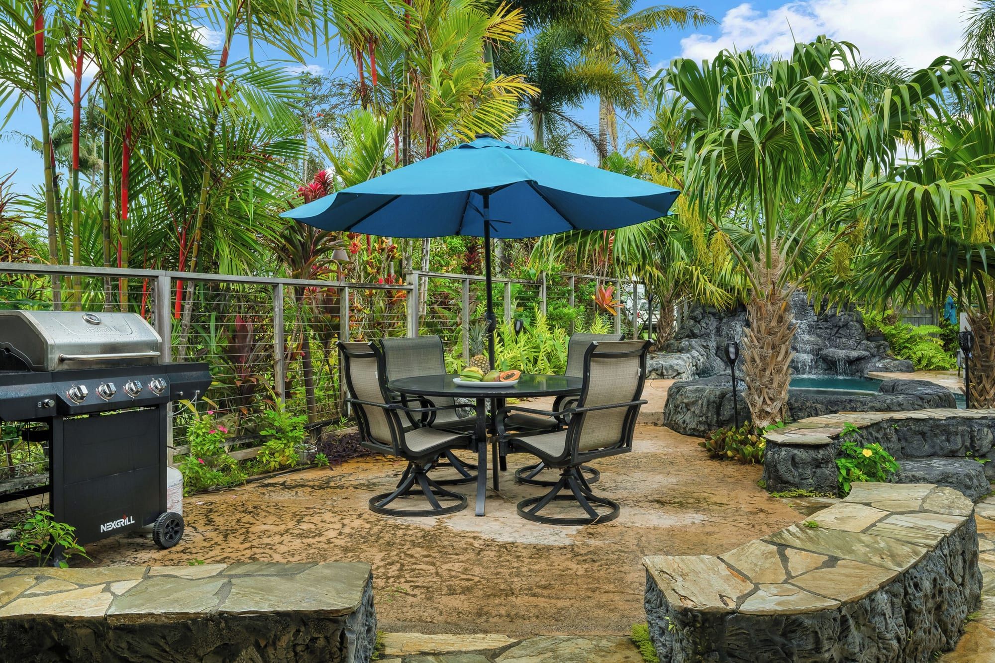 The gas grill and a bistro table in the garden